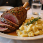 Delicious Slow Roast Lamb served with creamy Dauphinoise Potatoes.